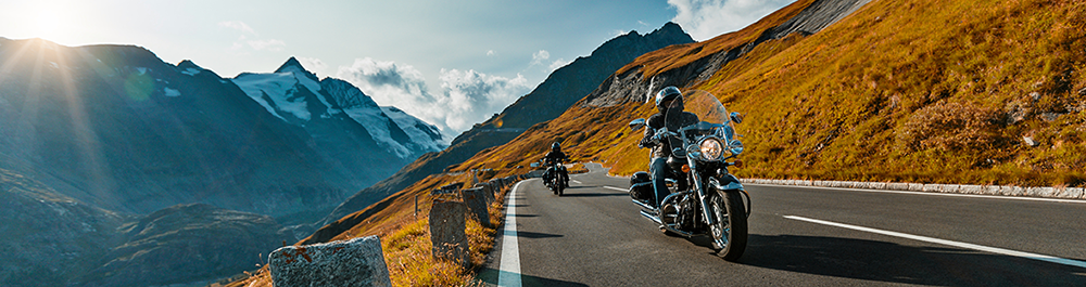 calimoto press area banner showcasing two motorcycle riders on a scenic route
