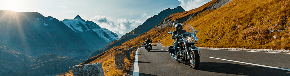 calimoto press area banner showcasing two motorcycle riders on a scenic route